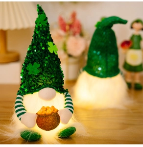 Detail of St. Patrick's Day glowing gnomes with green sequin hats and LED lights