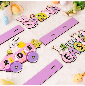 Detail of Happy Easter purple wooden signs with Spring and Rejoice festive patterns