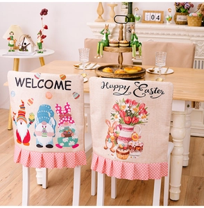 Detailed view of linen texture Easter chair covers with rabbit patterns and pink ruffles