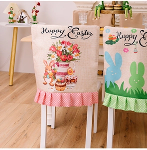 Detail of linen Easter chair covers featuring Happy Easter prints and polka dot ruffles
