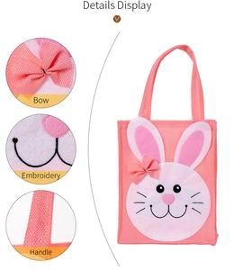 Detail of pink Easter bunny bag showing felt applique, embroidery, and ribbon handle