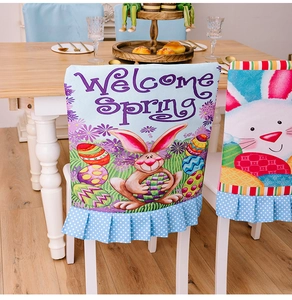 Detail of Easter chair cover featuring cartoon rabbits, eggs and blue polka dot ruffle hem