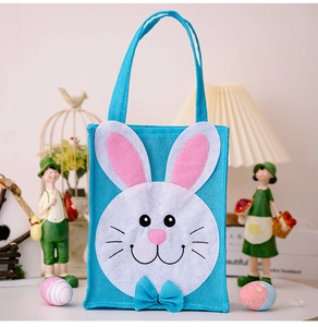 Blue Easter gift bag with cute white rabbit face patch and pink ears detail