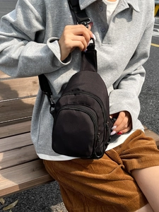 Minimalist black fitness waist bag for women featuring dual zipper compartments
