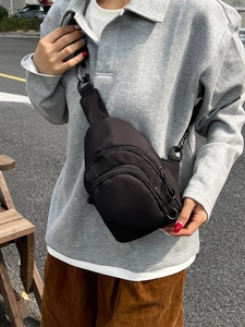 Versatile black multi-compartment fitness waist bag for women during outdoor activities