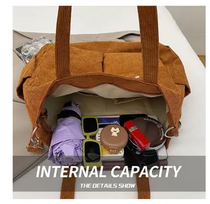 Internal view of caramel corduroy tote showing spacious compartment with daily essentials