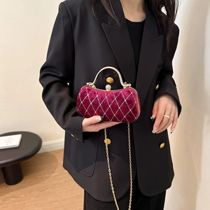 Velvet burgundy evening bag with diamond quilting and gold chain strap for parties