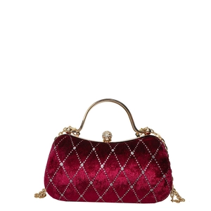 Elegant velvet evening clutch bag with diamond quilted pattern and gold metal handle