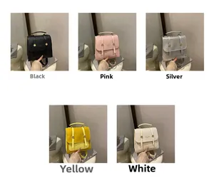 Mini crossbody bags with woven flap and metal rings shown in black, pink, silver, yellow, white