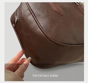Close-up of precise stitching and premium dark brown leather texture on bowling bag
