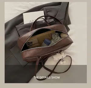 Top view of dark brown pebbled leather bag interior showing daily storage capacity