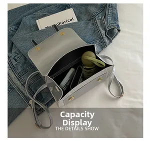 Detail view of the silver leather backpack interior showing large storage capacity