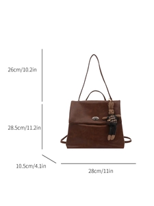 Brown vintage leather backpack with metal twist lock and cute bunny charm pendant