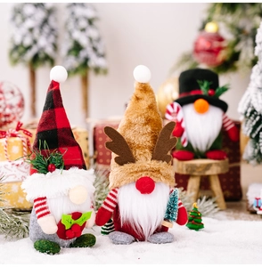 Three plush Christmas gnomes with plaid hats and antlers set in a cozy festive scene