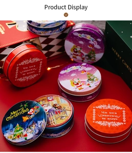 Close-up of assorted round tinplate Christmas coasters with festive holiday graphics