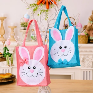 Easter cartoon rabbit burlap tote bags in pink and blue hanging on decorative branches