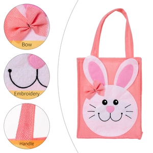 Pink Easter bunny gift bag made of textured linen fabric with bow and embroidery details