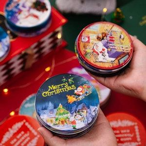 Christmas tinplate gift boxes with Santa and reindeer prints for holiday candy storage