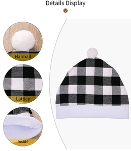 Detail view of black and white buffalo check baby knit hat with soft white pompom