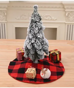 Classic red and black buffalo plaid Christmas tree skirt on a rustic wooden tabletop