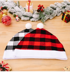 Festive red and black plaid Christmas hat seat covers on a decorated wooden background