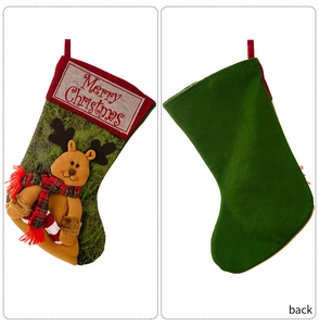 Detail of Christmas stocking featuring a 3D reindeer plush and Merry Christmas embroidery