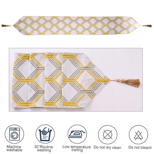 White modern table runner featuring yellow and grey geometric pattern with tassels