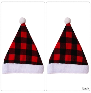 Detail of red and black buffalo plaid Christmas hat with plush trim and pom pom