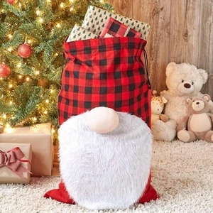 Red and black buffalo plaid Christmas gnome gift bag with plush beard and drawstring