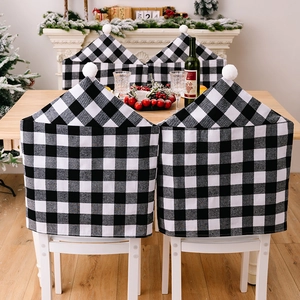 Lot de 4 housses de chaise de Noël à carreaux noirs et blancs avec pompons blancs