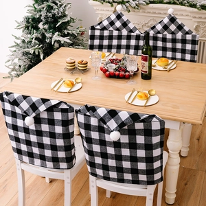 Housses de chaise de Noël à carreaux noirs et blancs avec pompons pour décor de table festive