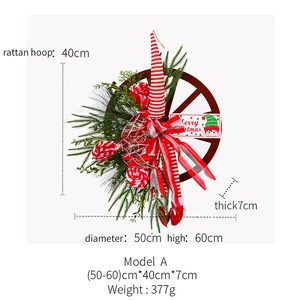 Detailed view of 60cm Christmas elf wreath with red bow and Merry Christmas sign
