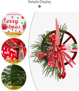 Detail showing the wood wheel base, silk ribbons, and pine leaves of the Christmas wreath