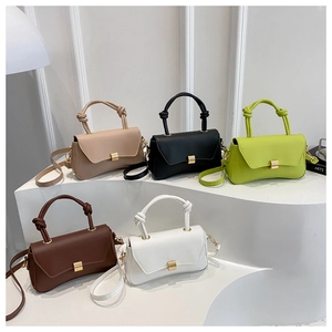Detailed view of fashionable PU leather crossbody bags with creative knot handle design