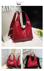 Detail view of red woven leather hobo shoulder bag with Intrecciato craft and large capacity
