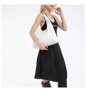 Detailed close-up of the white woven texture on a minimalist fashion hobo shoulder bag