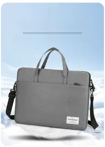 Lightweight grey oxford fabric laptop bag with white feathers on blue sky background