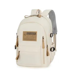 Detail of beige backpack featuring side pockets and breathable grey mesh shoulder straps