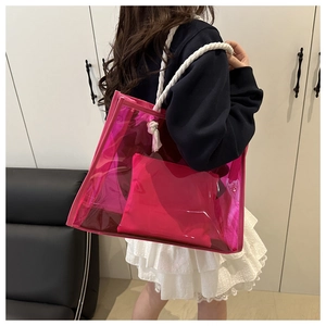 Pink iridescent PVC tote bag detail featuring durable cotton rope handles and inner pouch