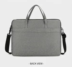 Gray laptop bag with back trolley strap for luggage, dual handles and shoulder strap