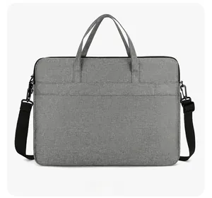 Gray laptop bag with back trolley strap for luggage, dual handles and shoulder strap