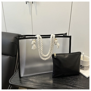 Detailed view of pink transparent PVC tote bag with cotton rope handles and inner pouch
