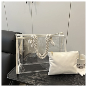 Close-up of clear PVC tote bag with white trim and thick cotton rope handle and inner pouch