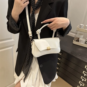 Minimalist white PU leather crossbody bag with knot handle and gold buckle detail