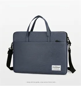 Detail of navy blue oxford fabric laptop bag with durable shoulder strap and handles
