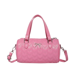 Pink heart quilted cylindrical Boston bag with bow charm and adjustable strap