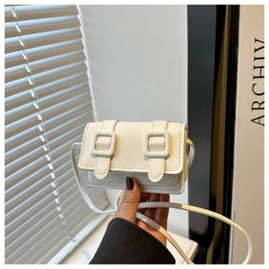 Detailed close-up of a mini off-white crossbody bag with dual strap buckle decorations