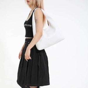 Minimalist white woven PU leather large tote bag shown on a model for daily use