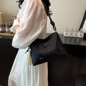 Black floral embroidery tote bag with butterfly appliques and decorative tassel