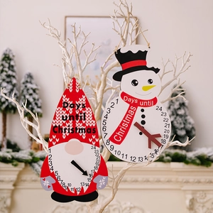 Detail of wooden Christmas countdown calendars featuring gnome and snowman with spinning pointers